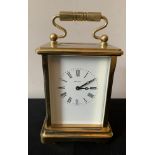 A Dominion carriage clock, 8 day, English made. Height to handle 16cms.Condition ReportGood