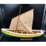A wooden model boat with sail "Sea Elk". Deck length 74cms width 15cms, height to mast 57cms.
