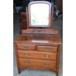 An oak 2 over 2 dressing table with brass handles and square legs. 84cms w x 46cms d x 70cms