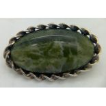 A silver and moss agate brooch of oval form, Dublin 1964. 4 x 2.5cms.Condition ReportGood