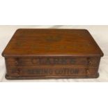 A Clarks sewing mahogany cotton box with 2 drawers and fitted separators to interior.Condition