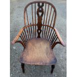 A 19thC elm, ash and yew wood Windsor chair with crinoline stretcher.Condition ReportOld wood