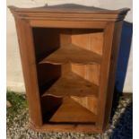 An open pine corner cupboard. 98cms h x 71cms w.Condition ReportSome old wood worm to the back.