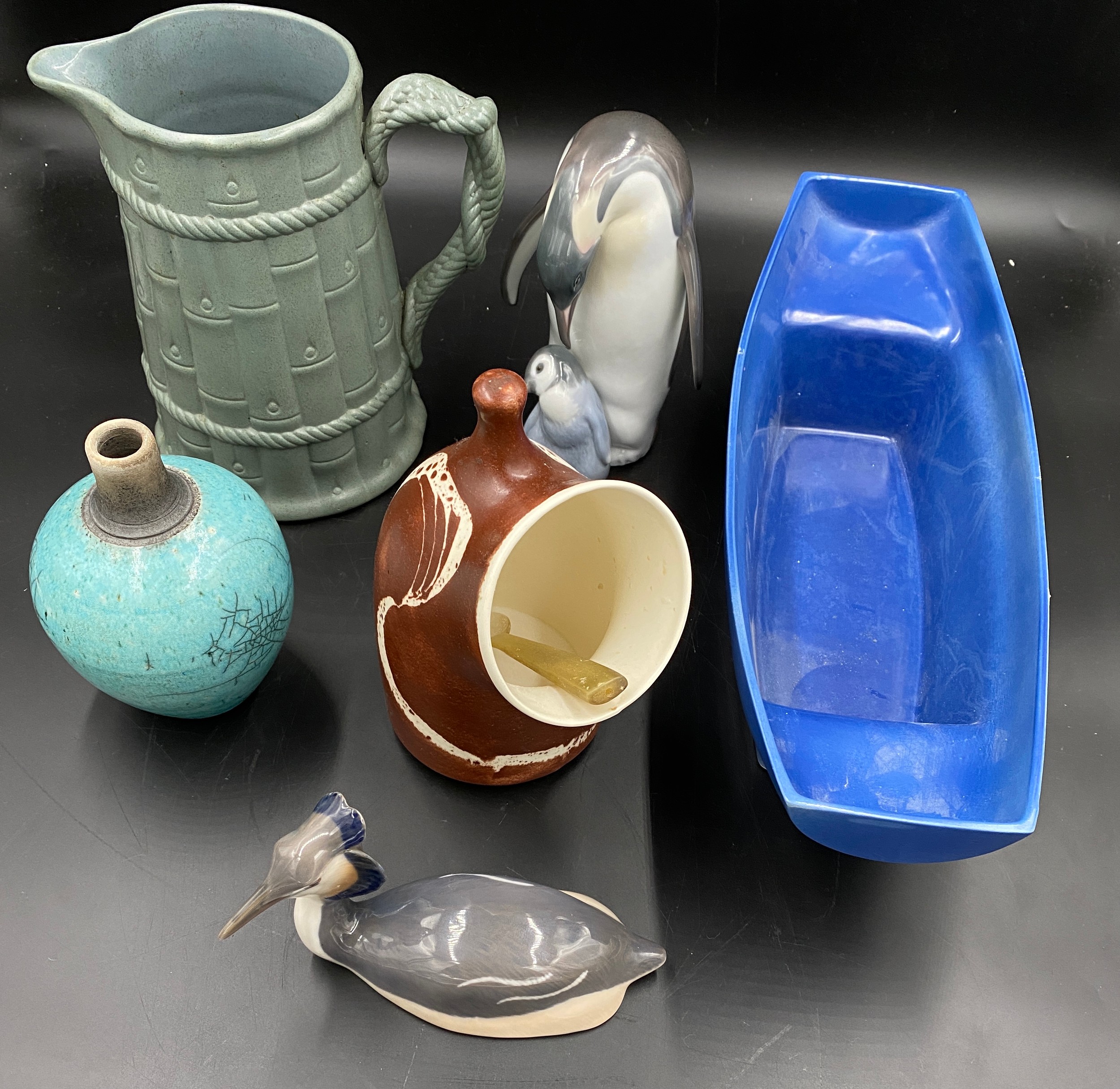 A selection of ceramics to include a blue Holkham pottery boat 42 x 15cms, an Aviemore Pottery