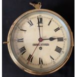 A Dobbie Mc Innes marine bulkhead clock, dial 20cms dial. Roman numerals with centre second hand.