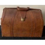 A vintage leather suitcase 47cms w x 37cms l.Condition ReportSome wear and marks to leather.