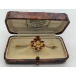A 19thC 9ct gold Scottish bar brooch with thistle surrounded by a circle of citrines. 4gms total