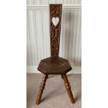 An oak spinning chair. 89cms h x 31cms w.Condition ReportGood condition.