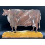 A decorative panel depicting a primitive bull. 39 x 52cms w.Condition ReportGood condition.