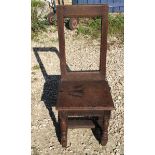 An 18thc oak nun's chair from Rise Convent. Height to seat 40cms, height to back 87cms, width