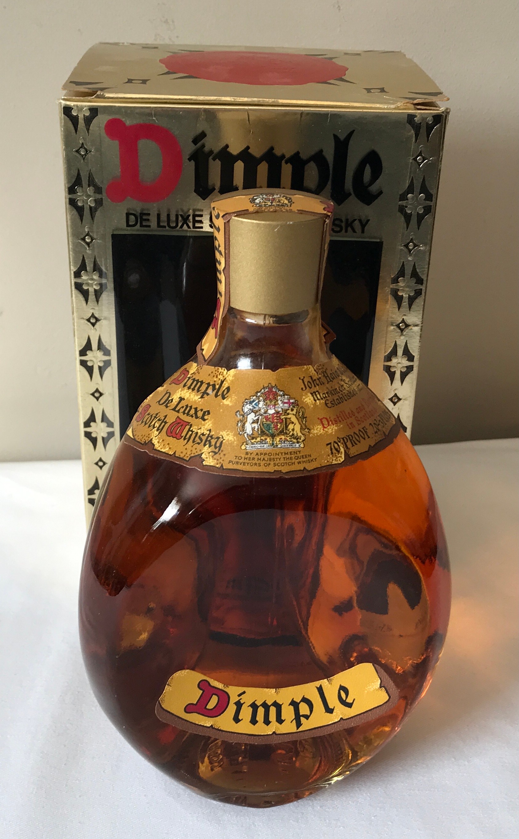 A boxed John Haig's Dimple deluxe scotch whisky 26 2/3 fluid ounces.Condition ReportSealed. Box with