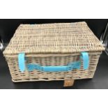 A wicker picnic basket and contents set for four people. 45cms w x 35cms d x 21cms h.Condition