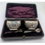 Silver salts with blue glass liners and fitted presentation case. Birmingham 1900, maker Joseph