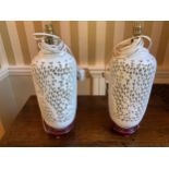 Pair of white ceramic table lamps. 45cms h.Condition ReportGood condition