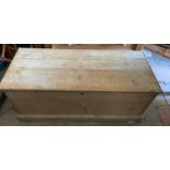 Pine blanket box. 111 w x 47 d x 43cms h with metal handles to side.Condition ReportSplit to top.