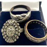 Three rings to include one silver and marcasite, one silver and one silver and 9ct gold.Condition