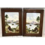 A pair of oak framed hand painted tile plaques of country lake and mountain scenes. Tile size 30.