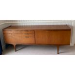 A Merridew teak sideboard with 2 doors, 3 drawers. 199cms l x 45cms d x 76cms h.Condition ReportWith