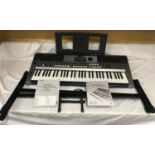 A Yamaha Keyboard PSR E443. Digital with keyboard stand and manual booklets. Condition ReportVery