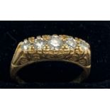 A five stone diamond ring set in 18ct yellow gold. Size M. 4.9gms weight.
