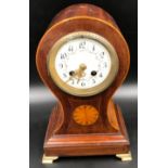 An Edwardian inlaid mahogany balloon clock with floral enamelled clock face and Arabic numerals.