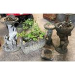 Five concrete garden ornaments to include 2 bird baths one 58cms h and 40cms h, a boy with planter