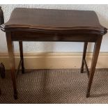 An Edwardian mahogany card table. 71cms h x 72cms w x38cms d. Cond: Slight lift to top.