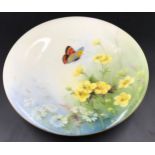 A Royal Worcester pedestal dish with floral and butterfly decoration. 23cms d x 5cms h.Condition