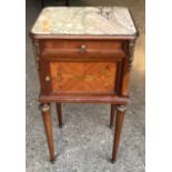 A French walnut bedside cabinet with coloured marble top, white marble interior, decorative brass