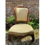 French walnut nursing chair with brass mounts and reduced legs. To seat 25cms h, to back 73cms h,