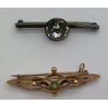 Two bar brooches, one in 9ct gold set with topaz, the other silver, maker Charles Horner. 11.1gms