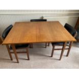 A Merridew extending teak dining table and 6 Merridew chairs. Extended 19cms x 89cms. Closed 118cms.