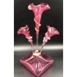 A ruby glass epergne with 3 flutes. 44cms h x 26cms w at base.Condition ReportOne side flute