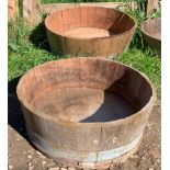 Two wooden coopered planters. 66 d x 24cms h.Condition ReportGood condition.