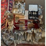 A large quantity of silver plated cutlery to include cased carving set, cased grapefruit spoons,