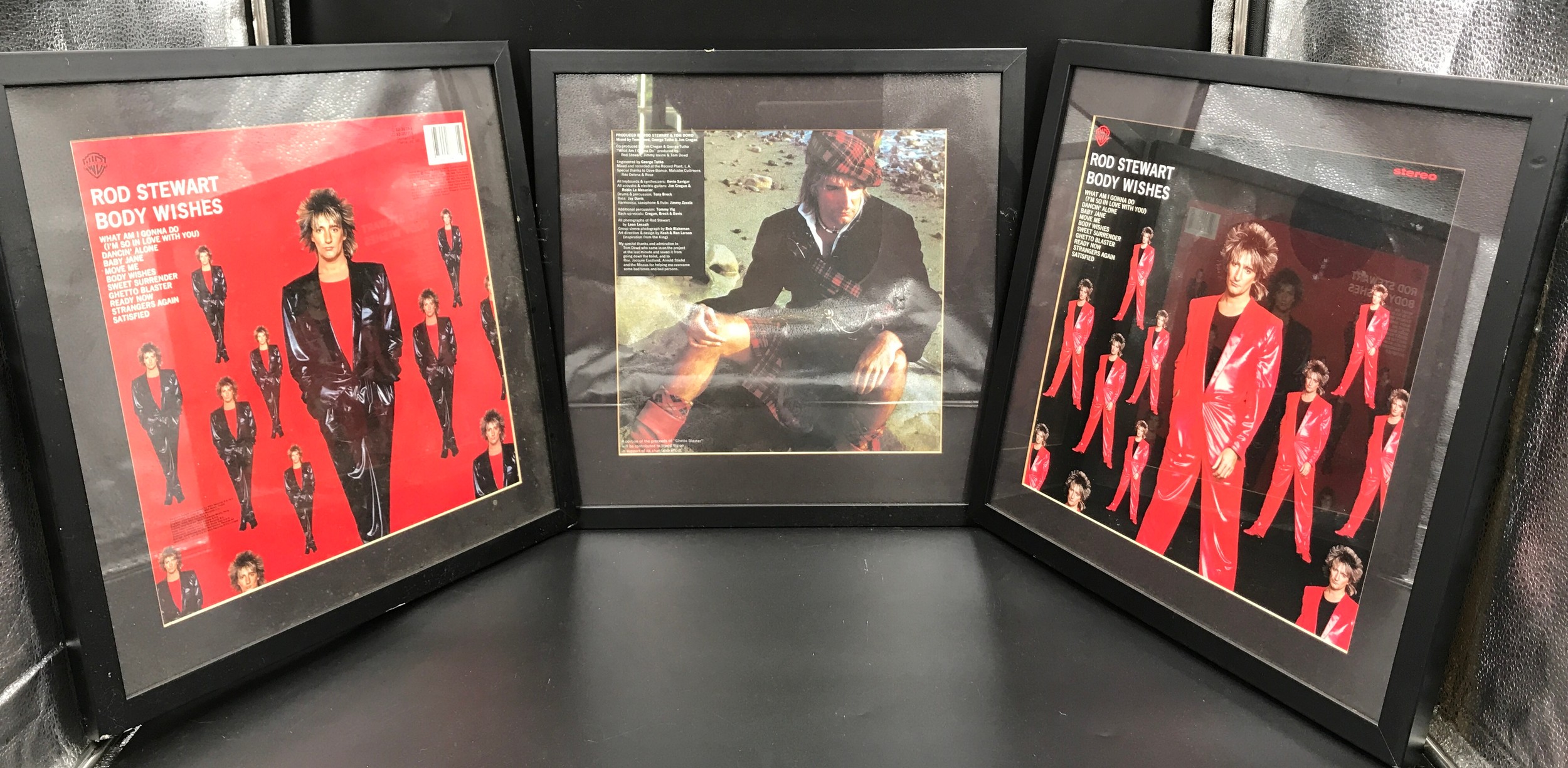 Set of three framed Rod Stewart album covers, Body Wishes front and back and Ghetto Blaster back