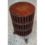 An Indian hardwood rotating cassette cabinet with brass inlay. 59cms h x 31cms w.Condition