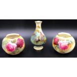 A pair of Royal Worcester bulbous vases 7cms h with rose decoration, one signed "M.Hunt" together