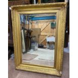 A large gilt bevel edged mirror. 69cms x 72cms.Condition ReportMirror good. Some gesso loss at