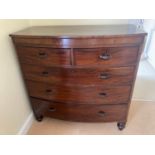 A 19thC mahogany bowfront chest of 2 short over 3 long drawers on turned legs. 114cms w x 54cms d