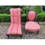 Two Victorian ebonised and gilt upholstered nursing chairs both with turn front legs ans castors.