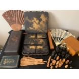 A miscellany comprising fans, oriental laquer boxes, part chess set, photograph frame etc.