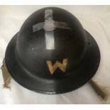 A WWII Warden's helmet together with silver ARP badge.Condition ReportChin strap broken and