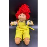 Vintage Cabbage Patch doll. 49cms h.Condition ReportDungarees lacking button.