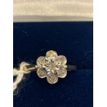 A 9ct gold ring cluster set with & diamonds. Size P. Weight 2.5gms.Condition ReportGood condition.