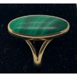 A 9ct gold and malachite dress ring. Size "0" 5.1gms.Condition ReportSlight scratch to stone.