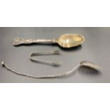 A hallmarked silver spoon London 1854 maker Henry Holland, sugar nips Birmingham 1909 maker I.S.