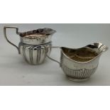 Two silver jugs, Birmingham 1903 and Chester 1899, maker Jay, Richard Attenborough and Co. 80.3gms