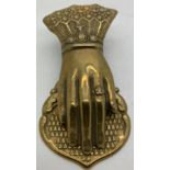 A figural brass novelty letter or paperclip modelled as a ladies hand. 13 x 6cms.Condition