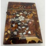 A tortoiseshell and mother of pearl card case. 10.5 x 8cms.Condition ReportSmall loss of veneer
